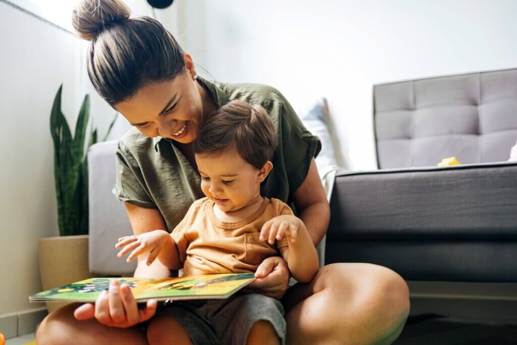 mom with postpartum brain fog reading a book to her toddler