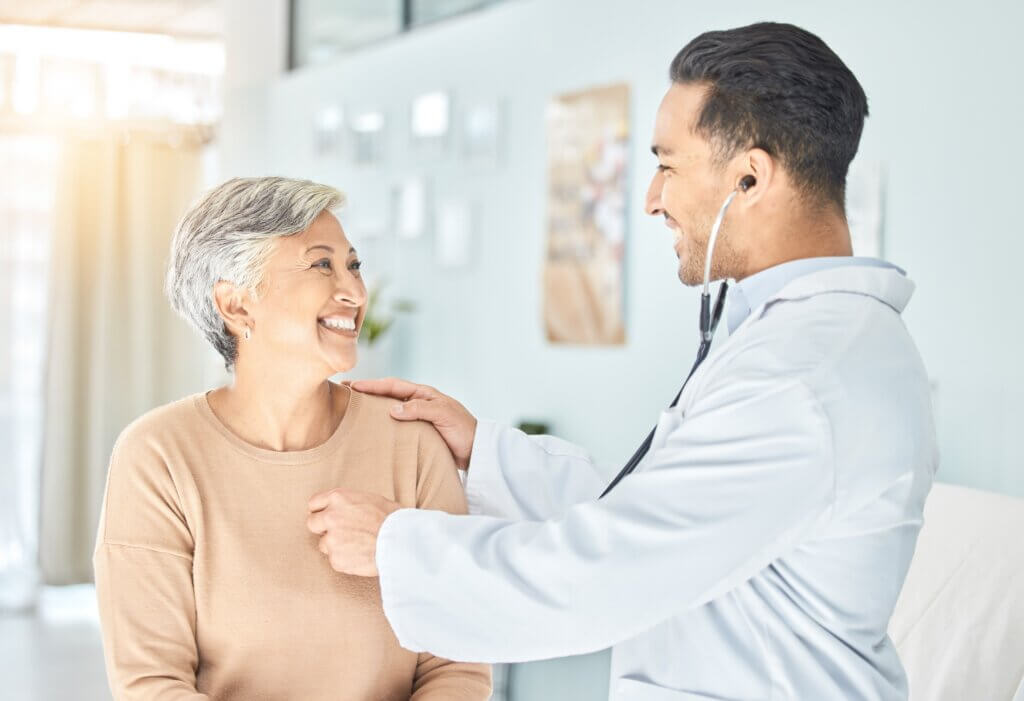 doctor listening to a patient's heart